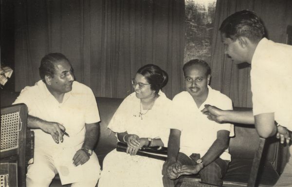 Mohd Rafi discussing with Hari Prasad Chaurasia and others in the recording studio