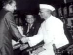 Mohdrafi receiving an award from Morarji Desai and Jaikishan watching in a function SAS.jpg